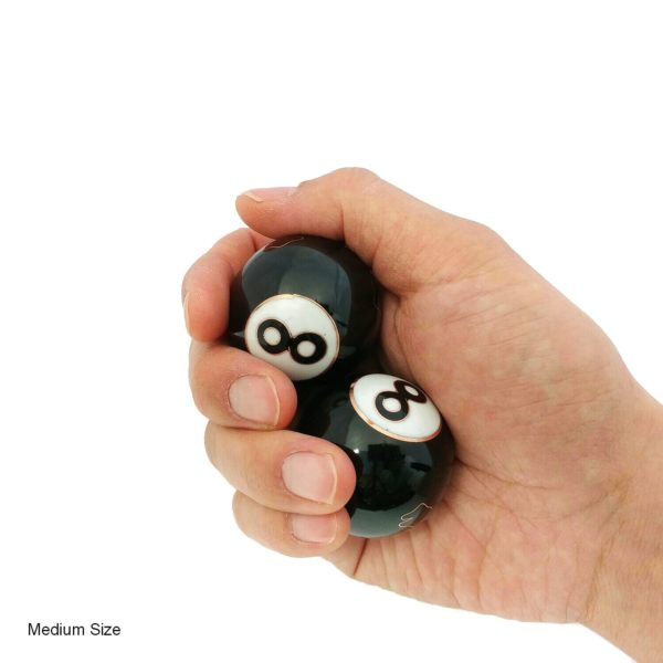 Hand holding medium 8 ball baoding balls