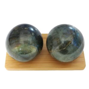 Labradorite baoding balls on a display stand