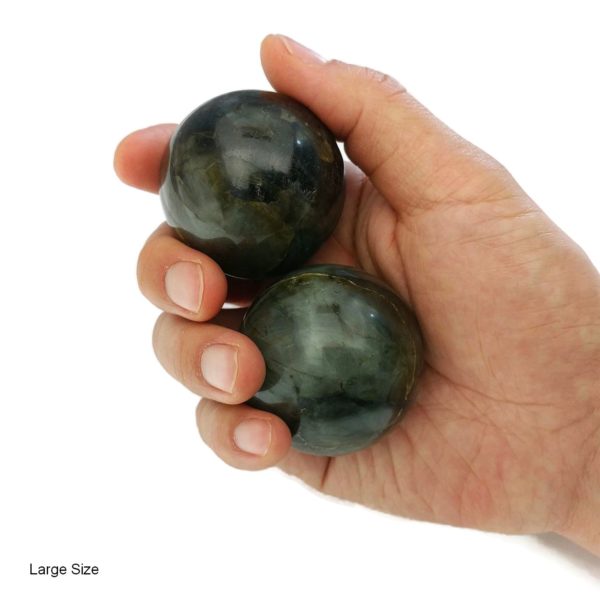 Hand holding large labradorite baoding balls