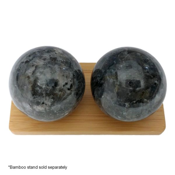 Blue pearl larvikite baoding balls on a display stand