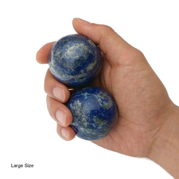 Hand holding large lapis lazuli baoding balls