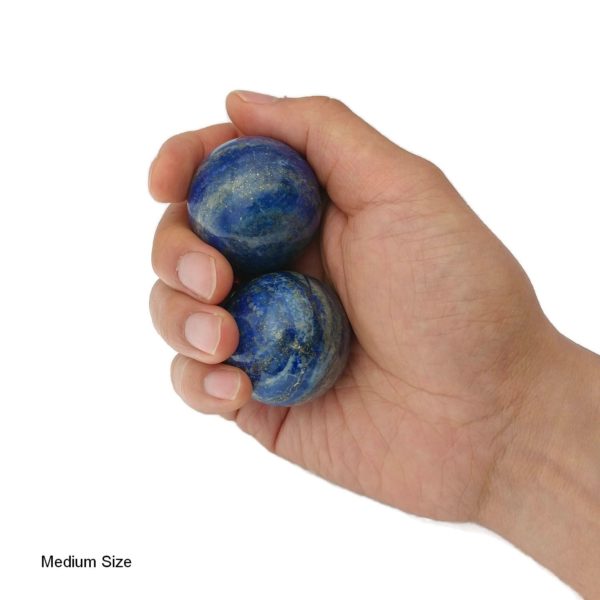 Hand holding medium lapis lazuli baoding balls
