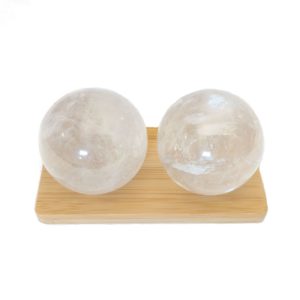 clear quartz baoding balls on a display stand