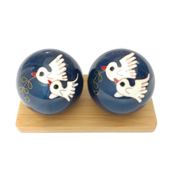 Dove baoding balls on a display stand