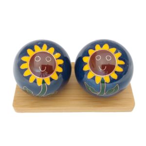 Sunflower baoding balls on a display stand