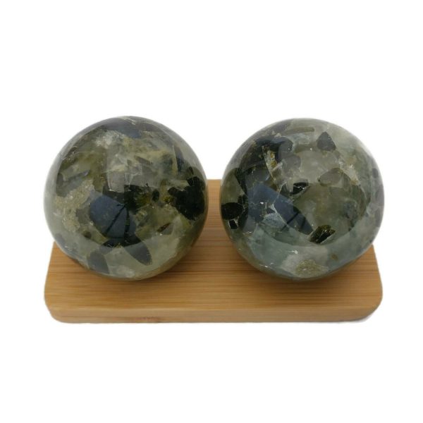 Prehnite baoding balls on a display stand