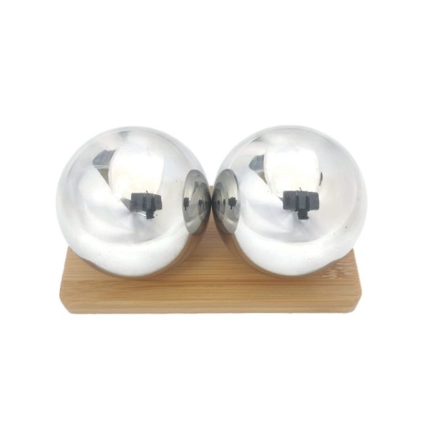 Stainless steel baoding balls on a display stand