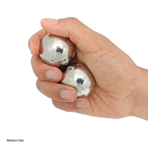 Hand holding stainless steel medium baoding balls