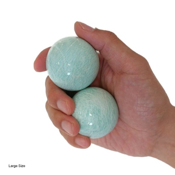 Hand holding large Amazonite baoding balls